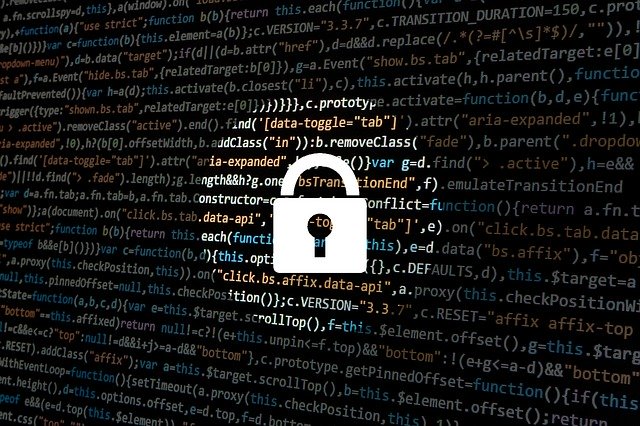 A screen showing code and a lock serves as a metaphor letting you know your data is secure using our 24/7 Monitoring.